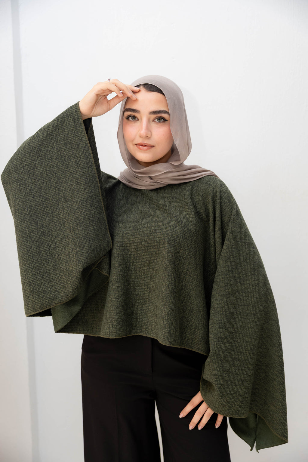 The Iconic Knit Cape in olive